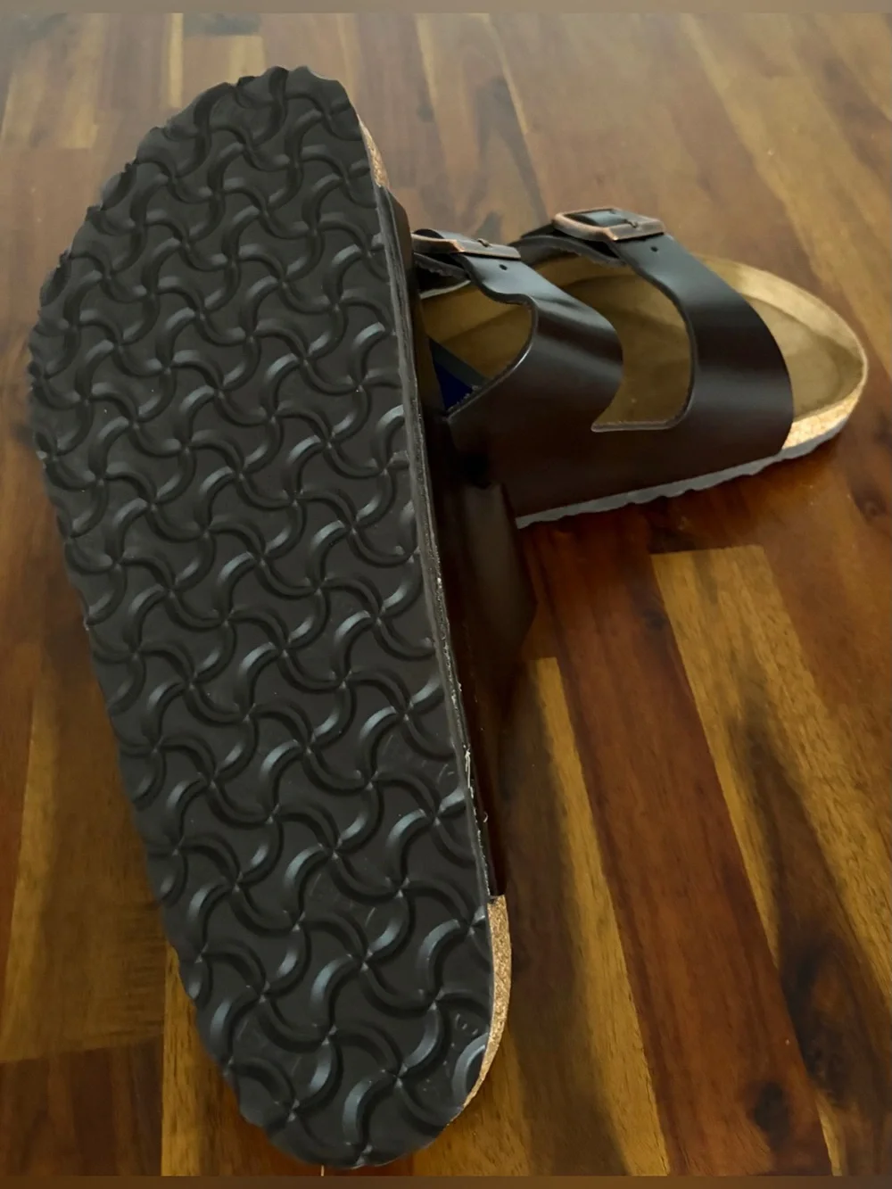 Birkenstock Men’s Arizona Two-Buckle Sandal — Dark Brown with Rose Gold Buckles.